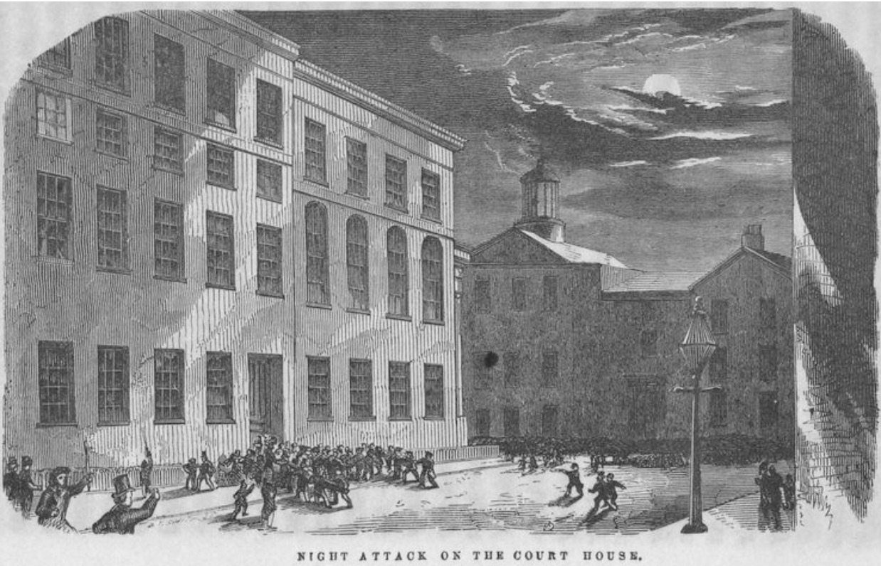 Period depiction image of the attack on the courthouse. Burns’s room is shown with a light on.