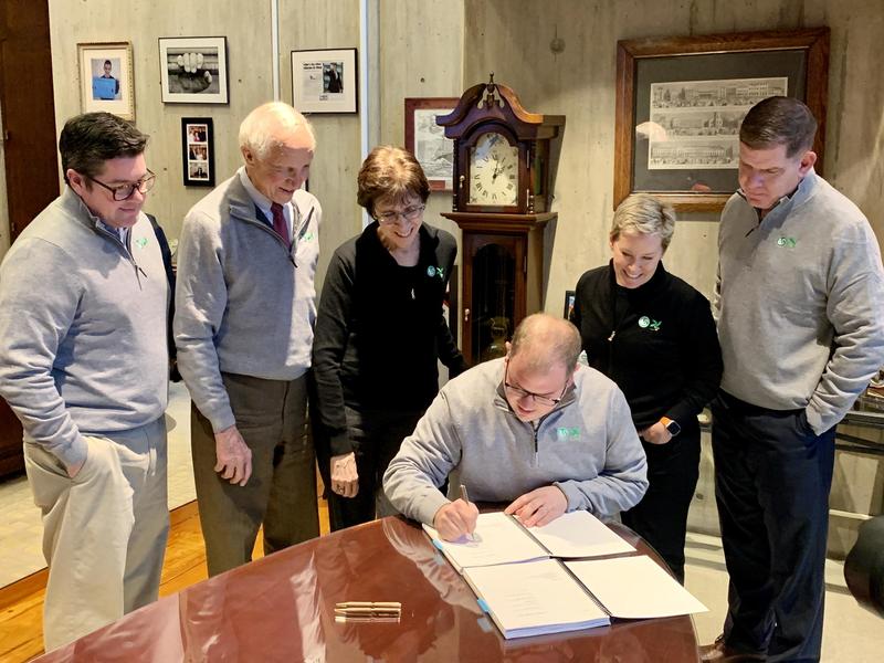 Commissioner Ryan Woods Signing the Memorandum of Agreement