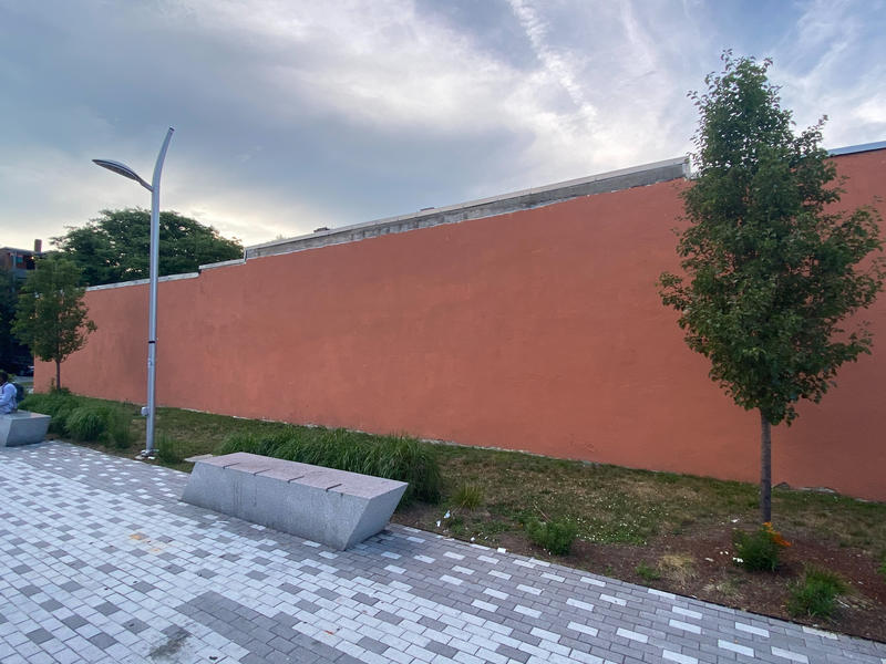 Orange Wall adjacent to plaza at Grove Hall municipal parking lot