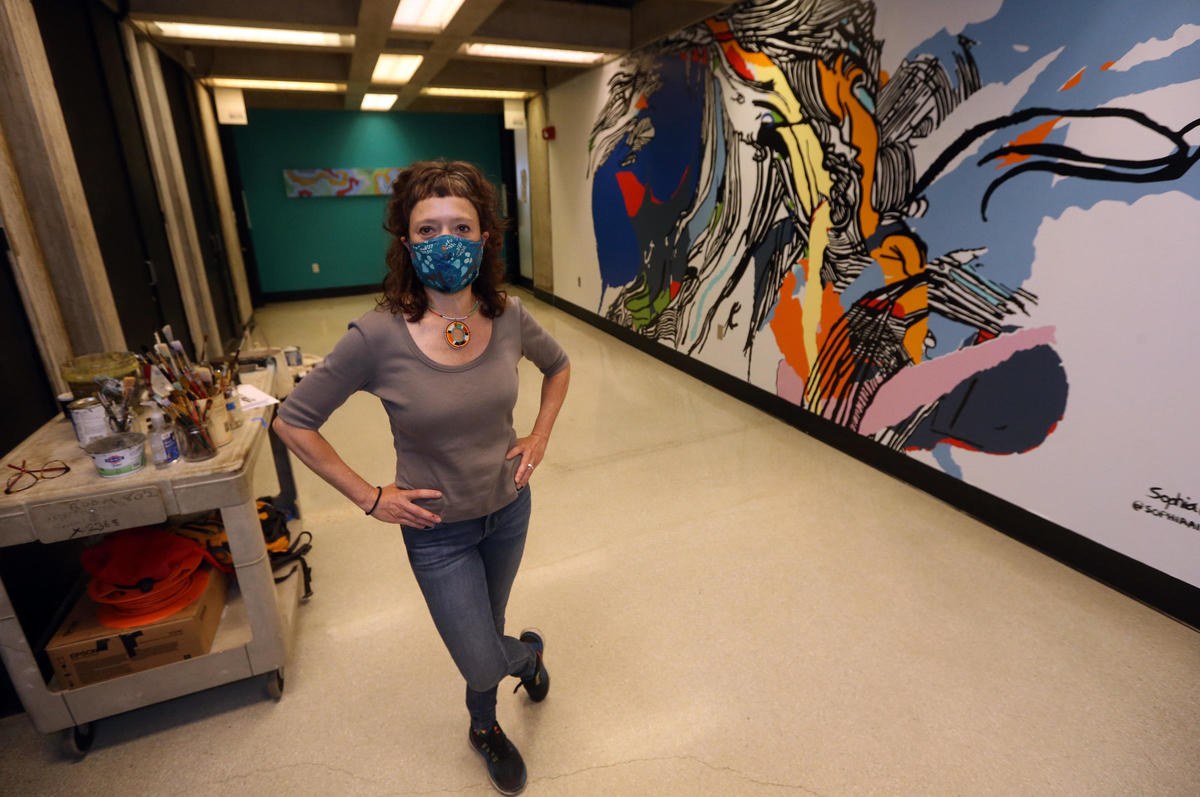 Sophia Ainslie with mural