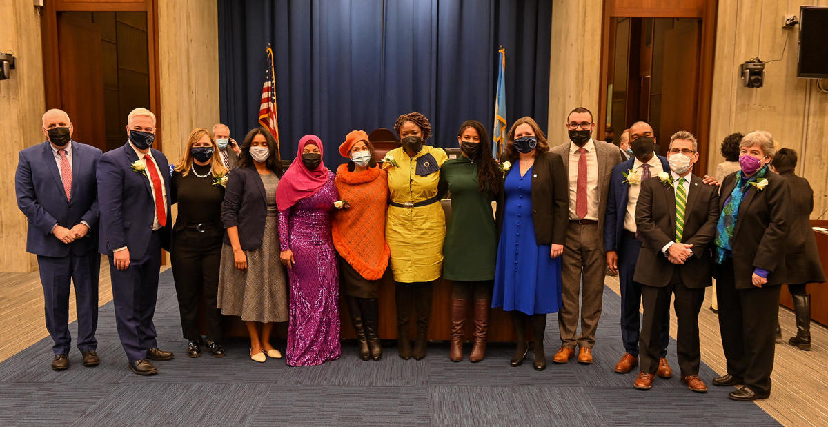 Boston City Councilors stand and pose for photo in Ianella Chamber