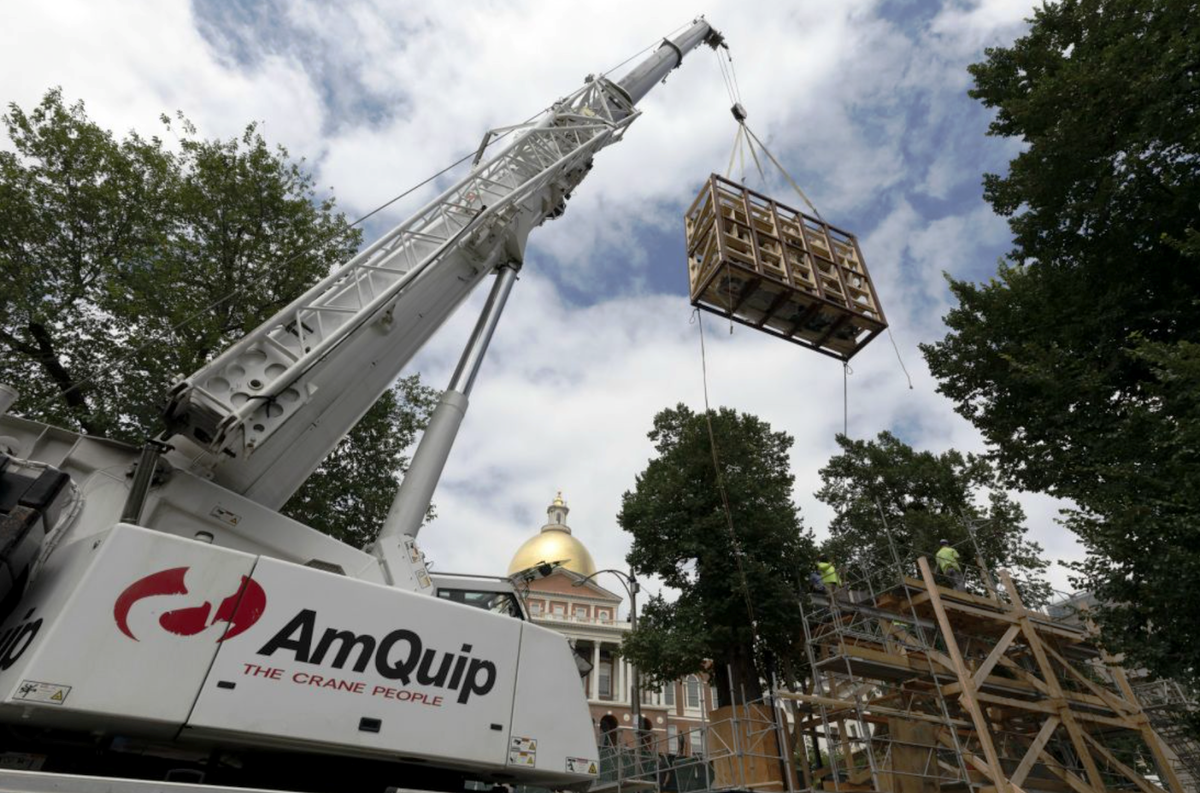 The restored Shaw 54th Regiment Memorial on Boston Common is lifted back into place in time for its public unveiling on June 1. 