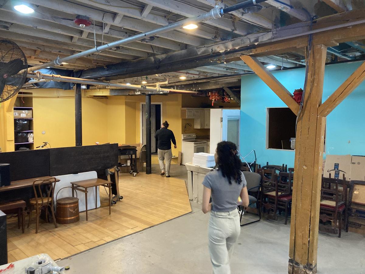 Sahomi taking a tour of artist space in Charlestown.