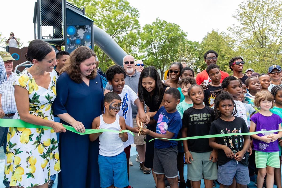 Mayor Wu cut the ribbon at the official reopening of Mission Hill Playground