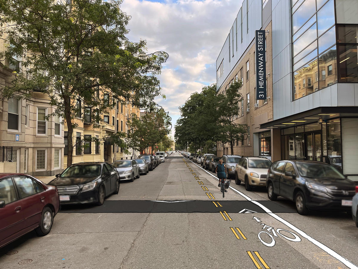A computer-illustrated rendering of Hemenway Street, showing a contraflow bike lane on the western side of the street and a speed hump in the foreground.