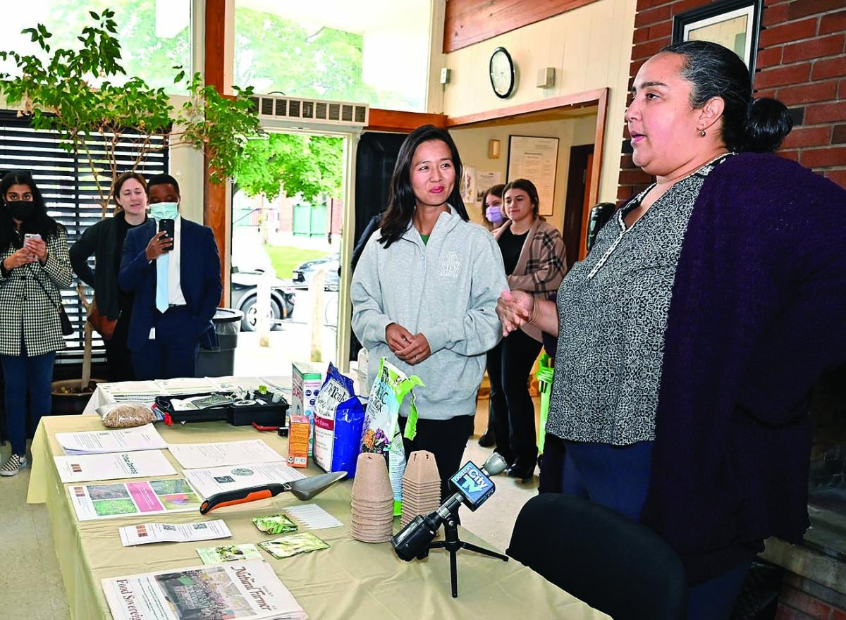 Shani Fletcher, director of GrowBoston, speaks about the City’s initiatives for gardening and urban farming as Mayor Wu looks on.