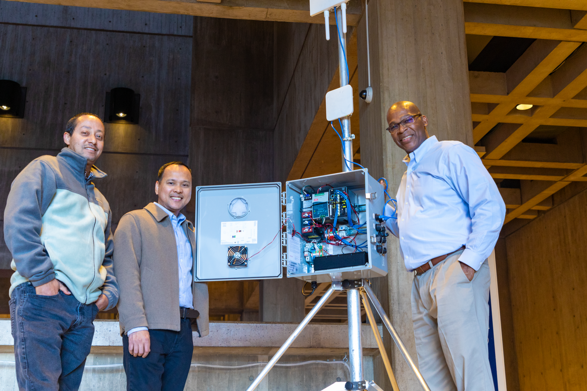 Fitzroy Brown with his team members on the NOC Team