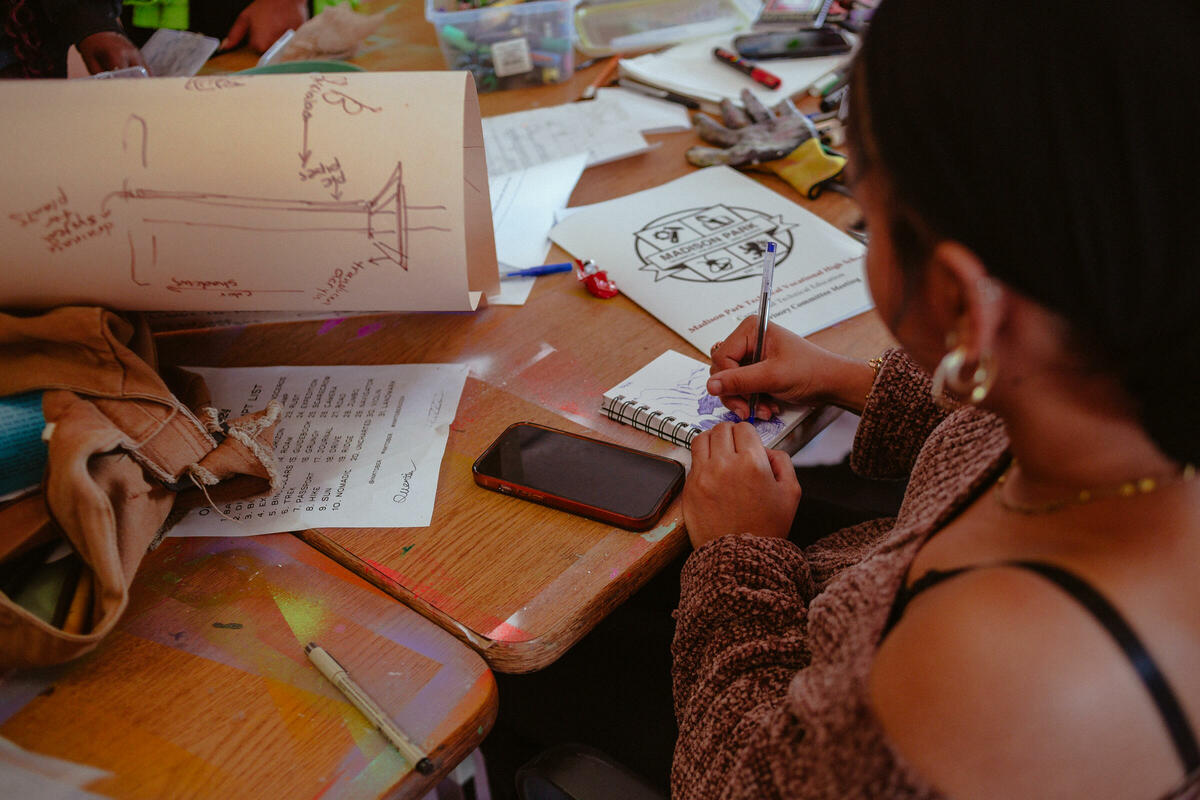 Image of student from Madison Park High drawing