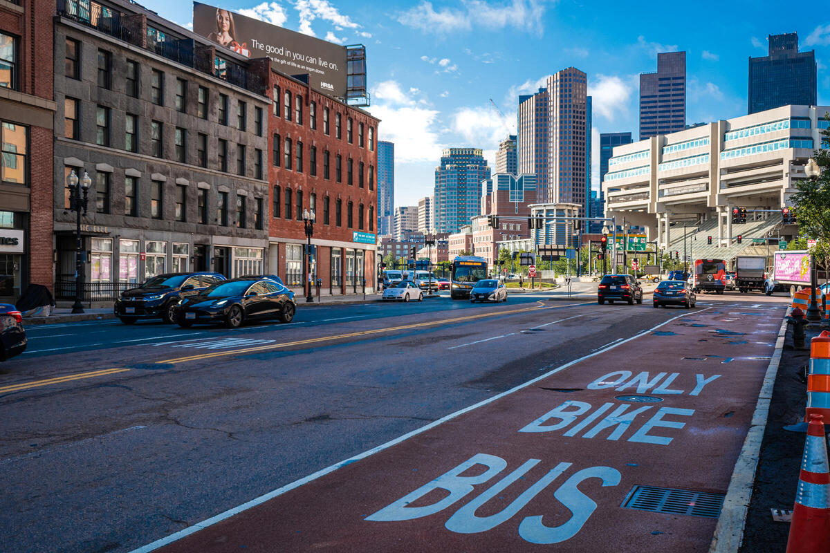 Red-painted Bus lane with white "bus bike only" letters on North Washington Street