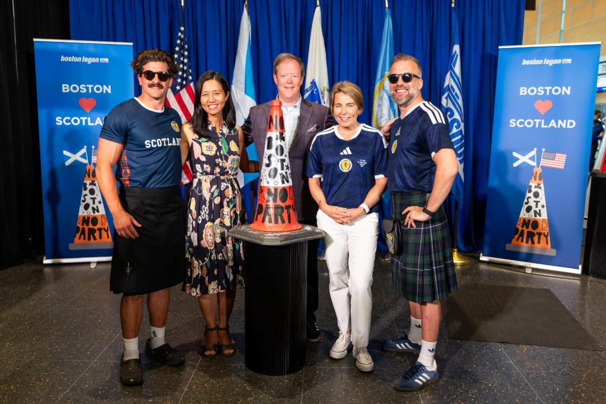 Danny Cambell, Mayor Michelle Wu, Massport CEO Richard Davey, Governor Maura Healey, and Andrew Dobbie pose for picture with Glasgow Traffic Cone