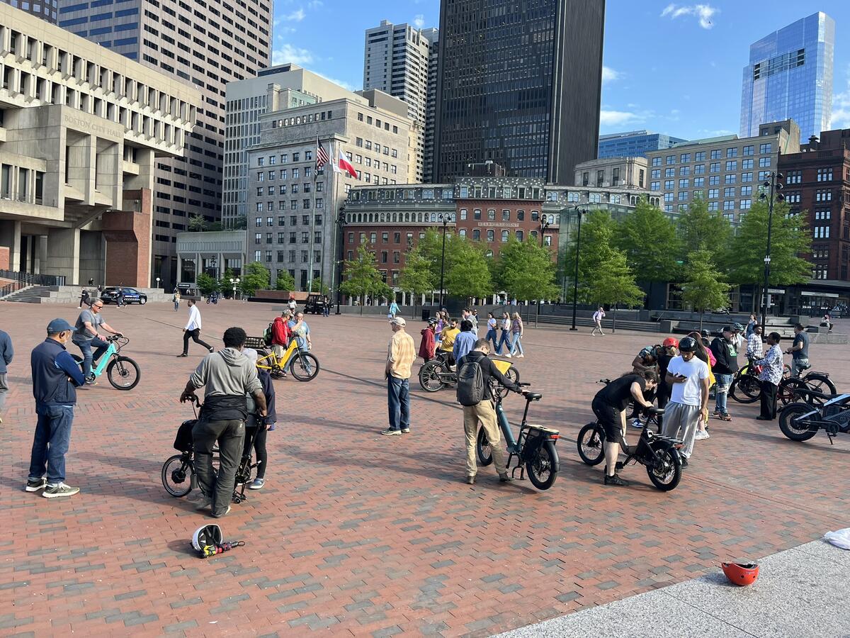 people test riding ebikes on the plaza
