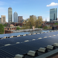 Boston with solar panels in the foreground