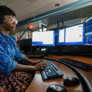 person working at the Boston Police 911 Dispatch Call Center