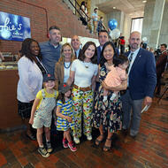  Scobie's Café & Bar owner Anne Lydon, and community members to cut the ribbon on Scobie's newest location at City Hall.