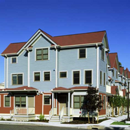 A photo of the Brian J. Honan Apartments on a sunny day.