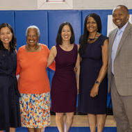 Mayor Michelle Wu and Commissioner of Public Health for the City of Boston Dr. Bisola Ojikutu join community partners for a photo.