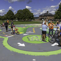Groups of people in conversations at a Bike Town